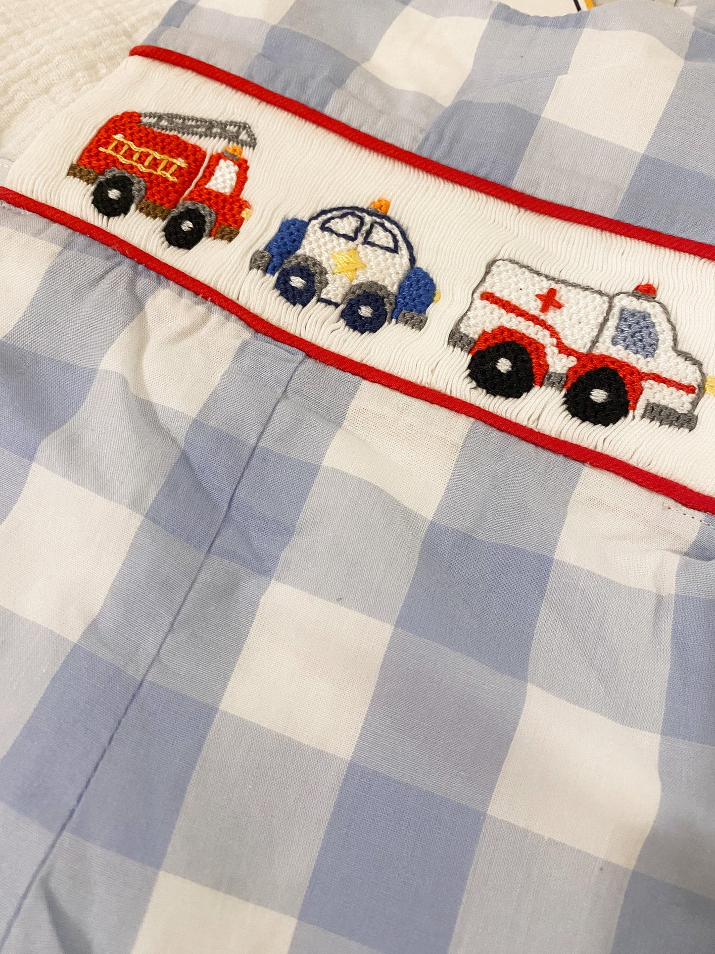 Emergency vehicles smocked boy shortall