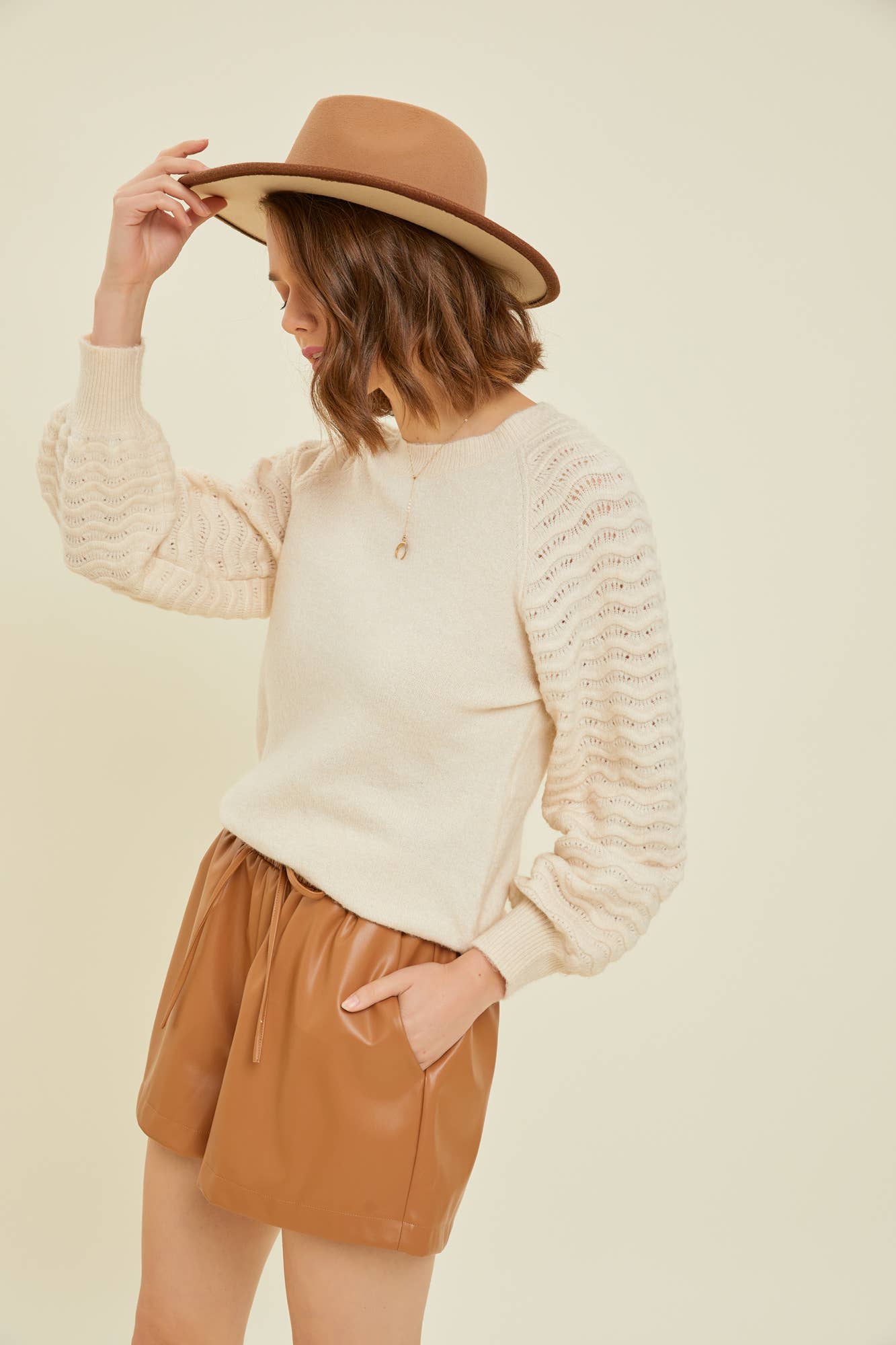 SWEATER WITH WAVE KNITTED SLEEVES