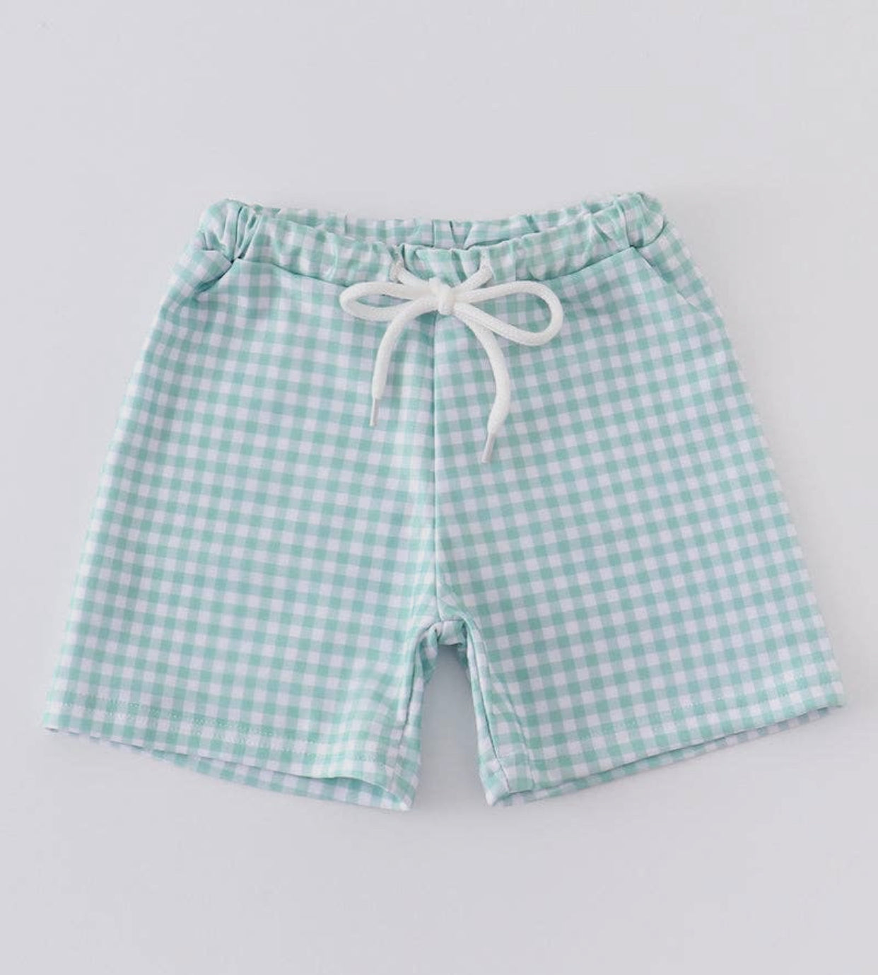 Green gingham swim trunks