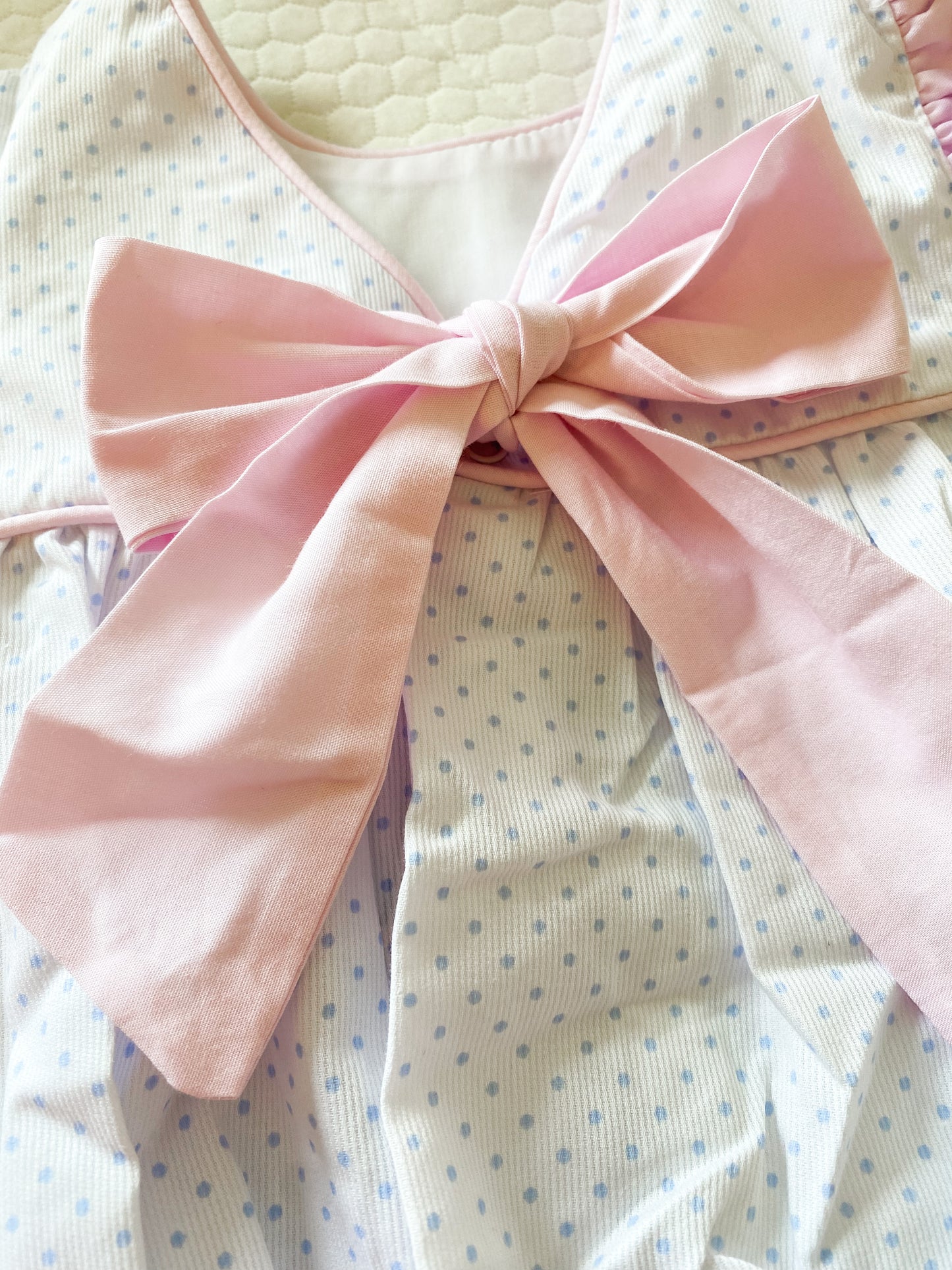 Blue polka dot bubble with pink bow