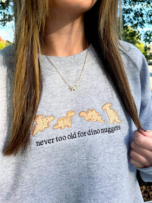 'Never Too Old For Dino Nuggets' Embroidered Crewneck Sweatshirt