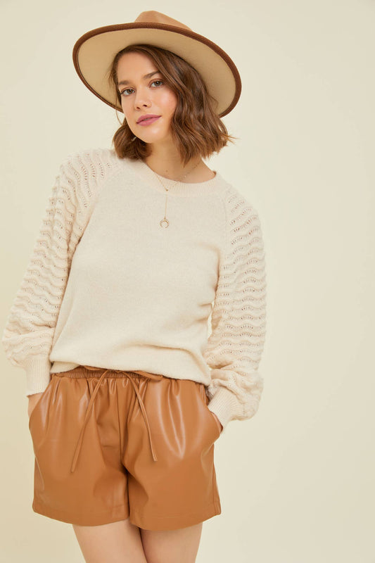 SWEATER WITH WAVE KNITTED SLEEVES